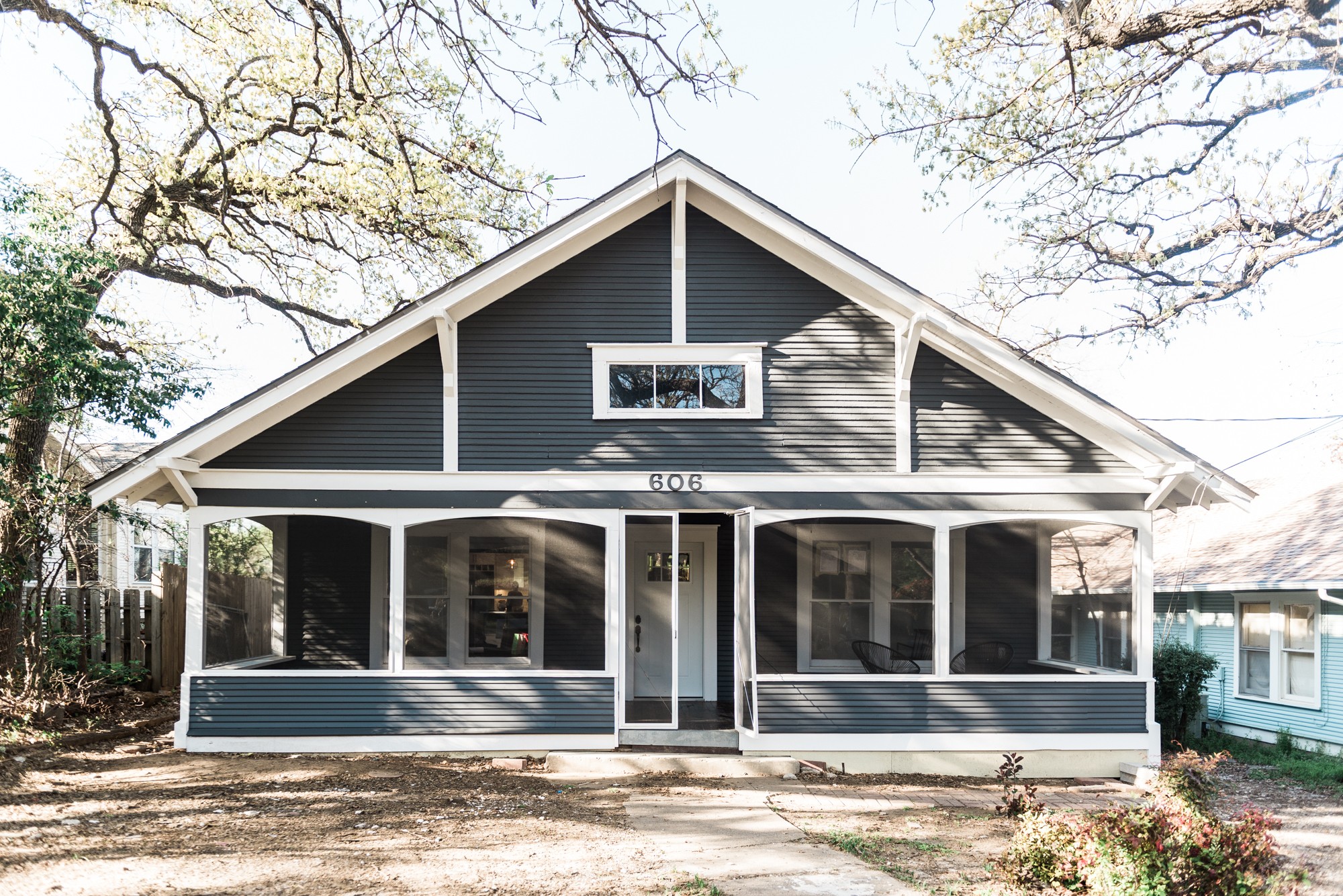 Denton TX Contractor, General Contractor Denton, DFW Contractor, Residential renovations Denton, Home renovations DFW, Denton Construction Companies, DFW construction companies, painted paneling, screened porch, hardwood porch, front porch, black and white exterior paneling,